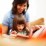 Mother and Daughter Reading Together --- Image by © Royalty-Free/Corbis
